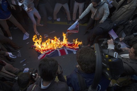 Iranian protesters burn British flag (Reuters)