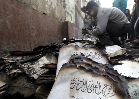 Volunteers collect burnt manuscripts, Cairo