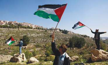 Palestinian flags waving in West Bank - Photo: Reuters 