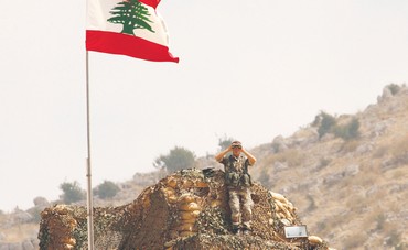 Lebanese soldier peers at Israel along border 