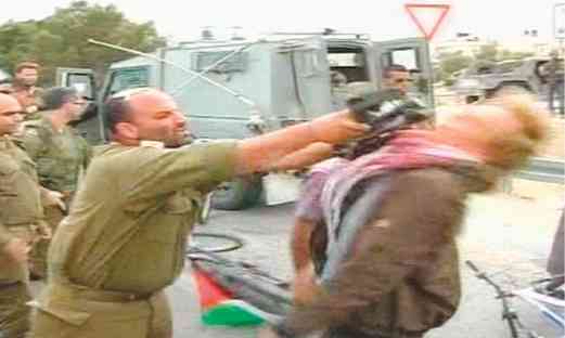 Screen capture from video of Shalom Eisner striking activist Photo: Reuters