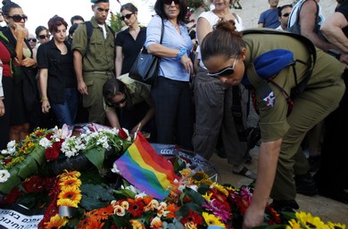 Mourners gather around the grave of Nir Katz (Reuters)