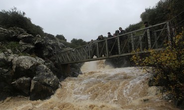 IDF soldiers on bridge over Saar falls in Golan
