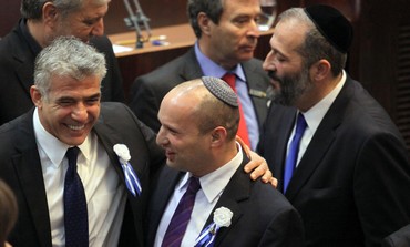 Yesh Atid leader Yair Lapid and Bayit Yehudi head Naftali Bennett at Knesset swear in, Feb 5, 2013.