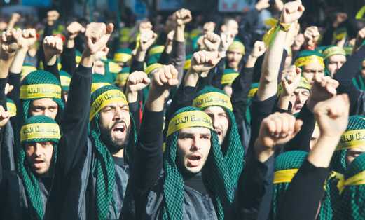 HEZBOLLAH SUPPORTERS march through the streets of Beirut last year.