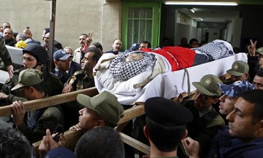 Body of Maysara Abu Hamdeya before his funeral in the West Bank city of Hebron, April 3, 2013.