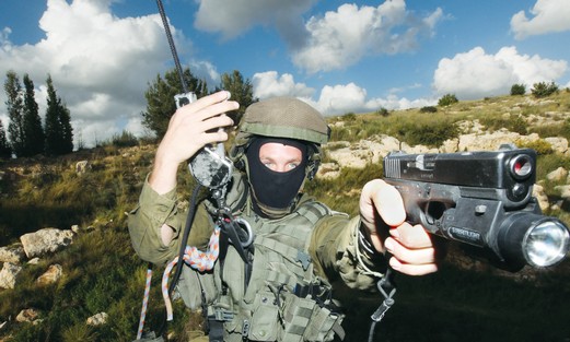 A counter-terrorism instructor holds his weapon at the IDF’s Mitkan Adam base near Modi’in.