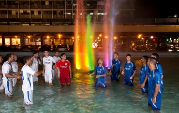Fountain in Rabin Square lit up with colors of pride flag