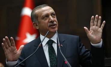 Turkey's Prime Minister Tayyip Erdogan addresses members of parliament from his ruling AK Party 