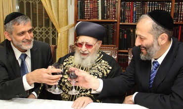 Happy times: Former Shas party head Eli Yishai and current leader Arye Deri celebrate a cooperation agreement prior to the national elections, with the blessing of their spiritual leader Rabbi Ovadia Yosef, at the rabbi