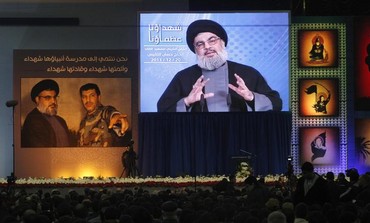 Hezbollah chief Hassan Nasrallah addresses supporters via broadcast in Beirut.