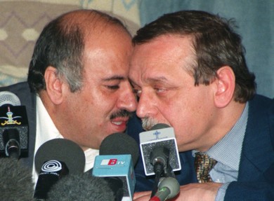 Rajoub speaks with Palestinian minister Yasser Abed Rabbo in 1998. (Reuters)