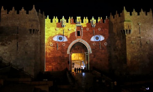 Damascus Gate, which leads to Jerusalem’s Old City, is projected with blue eyes to promote the capital’s 6th annual International Festival of Light, June 10, 2014.