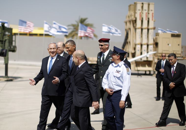 US President Barack Obama walks with Prime Minister Benjamin Netanyahu as he views an Iron Dome Defense Battery at Ben-Gurion International Airport, March 20, 2013