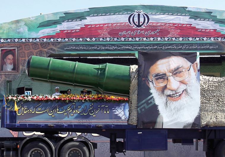 A MILITARY truck carrying a missile and a picture of Iran’s leader Ayatollah Ali Khamenei drives in a parade marking the anniversary of the Iran-Iraq war in Tehran (REUTERS)