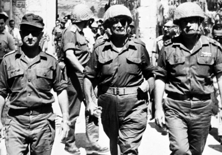 Photo taken in June 1967 in Jerusalem shows the chief-of-staff of the Israeli army, Yitzhak Rabin (R), Defense Minister Moshe Dayan (C), and GOC Central Command Uzi Narkiss during the Six-Day War (photo credit: AFP PHOTO)