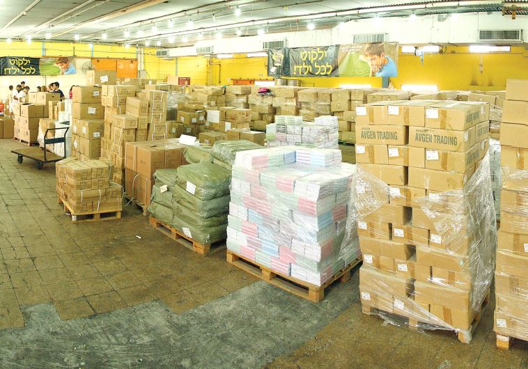 Boxes and boxes of backpacks to be delivered to families in need (photo credit: IFCJ)