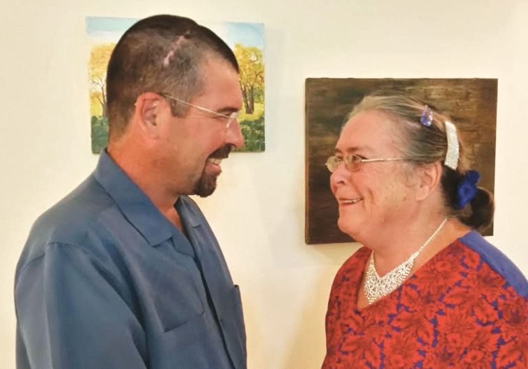  Daly and his mother, Ruth, share a light and caring moment at her home in Ashkelon (photo credit: JOHN DALY)