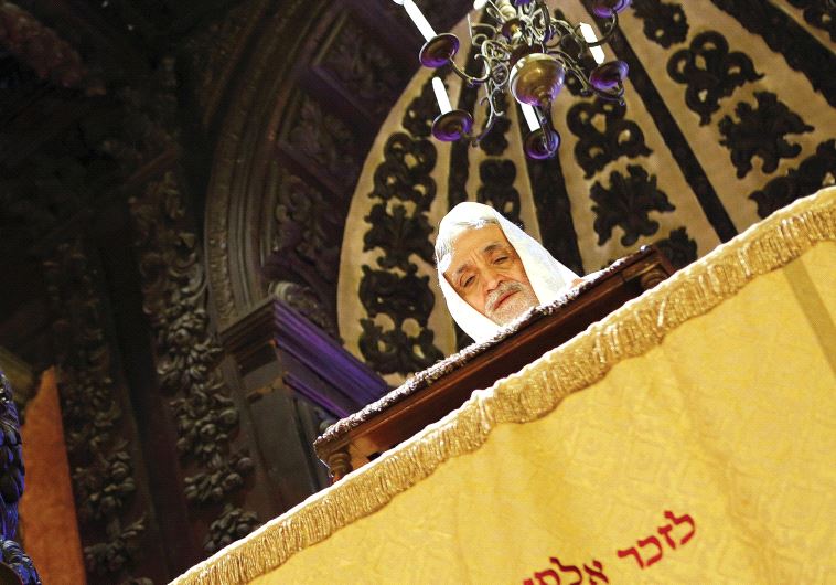 Rabbi Shalom Bahbout prays in the Levantine synagogue (photo credit: REUTERS)