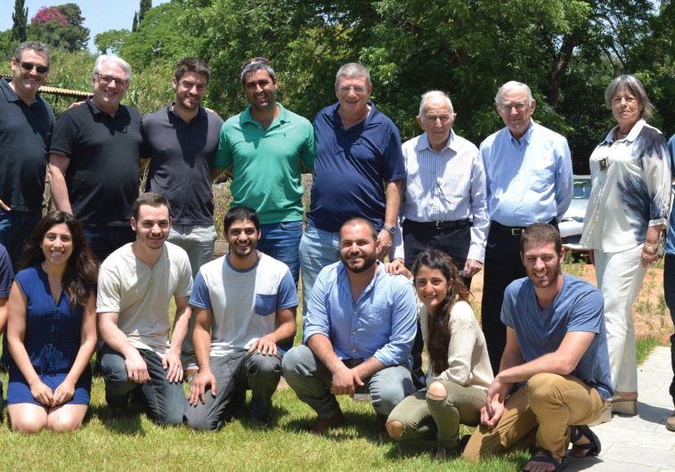 FFL founder Gili Cohen (back row, fourth from the left) stands to the right of organization president CEO Maj.-Gen. (res.) Eliezer Shkedi with other members of their team