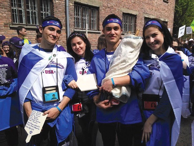 STUDENTS FROM a Boca Raton high school take part – along with the restored Torah scroll – in the March of the Living in Auschwitz earlier this year. (Courtesy)