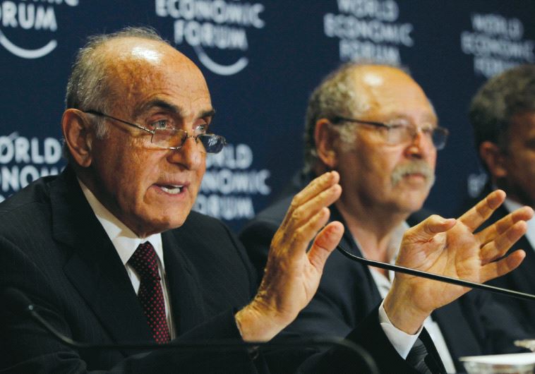 Al-Masri (left) as chairman of Palestine Development and Investment Company and Israel’s Yossi Vardi, chairman of International Technologies Ventures Inc. in 2013 (photo credit: REUTERS)