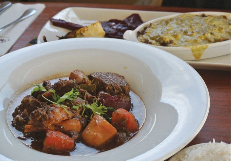 Beef stew and sinia at InnSense restaurant, Mitzpe Ramon(photo credit: SETH J. FRANTZMAN)