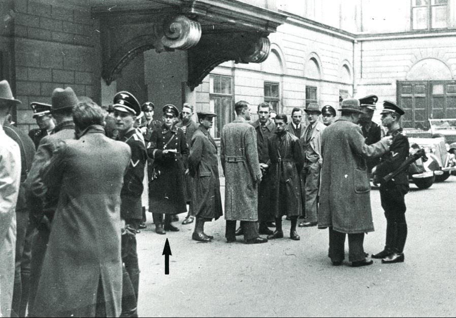 Police and SS, including Adolf Eichmann (see arrow), gather in a courtyard before the start of the round-up of the Jewish community in Vienna on March 18, 1938 (photo credit: DOCUMENTATION CENTER OF AUSTRIAN RESISTANCE)
