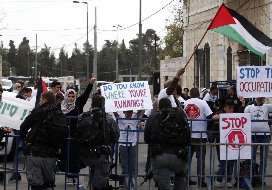 Demonstrators protest against Jerusalem's annual marathon.(photo credit: AHMAD GHARABLI / AFP)
