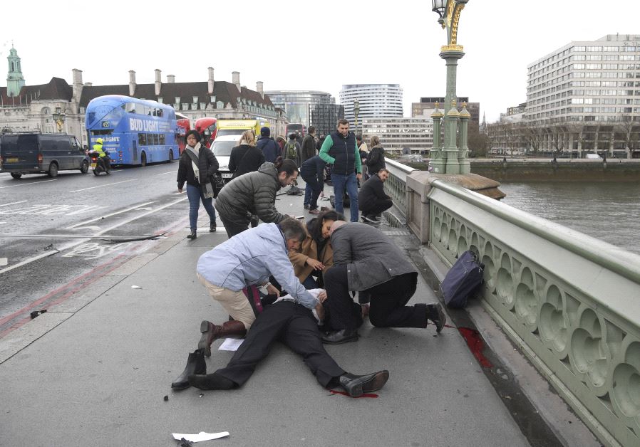 Injured people are assisted after an incident on Westminster Bridge in London, March 22, 2017.  (Reuters)