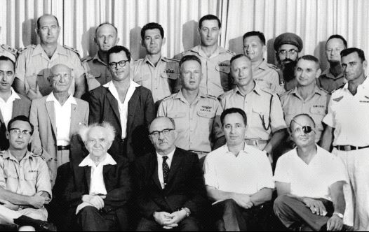 THEN-DEFENSE MINISTRY director-general Shimon Peres (seated second right) attends a meeting of the IDF General Staff with prime minister David Ben-Gurion in 1961. Peres is sitting between finance minster Levi Eshkol and agriculture minister Moshe Dayan. (GPO) 