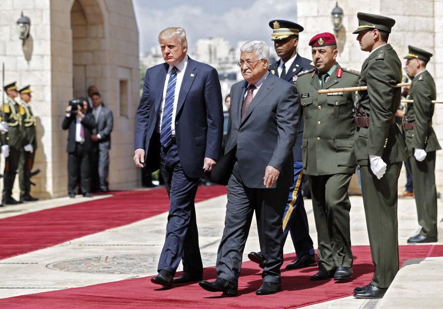 US President Donald Trump (L) and Palestinian leader Mahmud Abbas (2nd L) review the honour guard at the presidential palace in the West Bank city of Bethlehem on May 23, 2017 (THOMAS COEX/AFP)