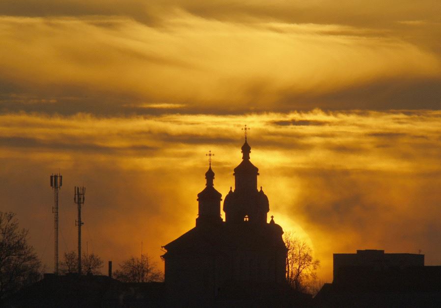 The sun rises above an Orthodox Church in the town of Novogrudok (Reuters/Vladimir Nikolsky)