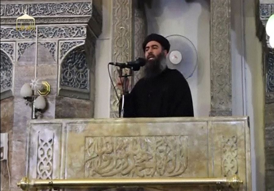 Al-Baghdadi proclaimed himself 'caliph,' or ruler of all Muslims, from the pulpit of the al-Nuri Mosque on July 4, 2014 (credit: REUTERS/SOCIAL MEDIA WEBSITE VIA REUTERS TV)