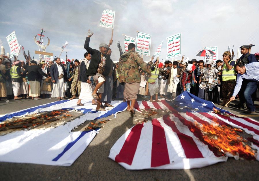 HOUTHI FOLLOWERS burn US and Israeli flags during a demonstration in Sanaa, Yemen in 2017