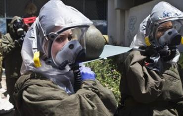 Israeli soldiers evacuate a mock victim during a drill simulating a chemical attack May, 2013.