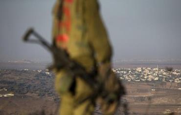 An Israeli soldier on the Golan Heights near Syria border