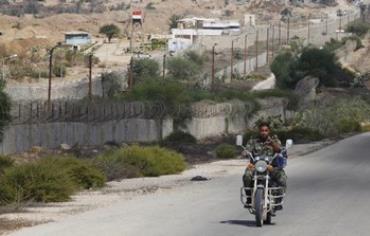 A member of Hamas security forces rides a motorcycle on the border between Egypt and southern Gaza.