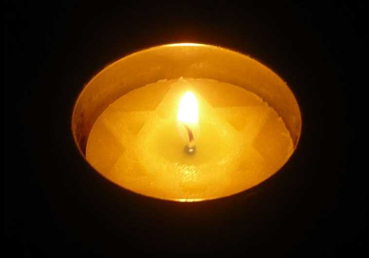 A memorial candle (credit: Wikimedia Commons)