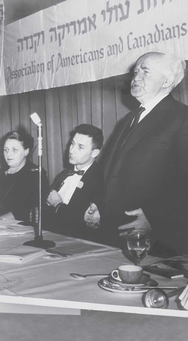 David Ben-Gurion addresses an AACI dinner at the Sheraton Hotel in 1961 next to Murray Greenfield. (credit: MURRAY GREENFIELD)