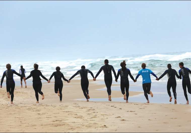 HaGal Sheli in Tel Aviv and Bat Yam teaches at-risk youth how to surf. (credit: YANAI YECHIEL)