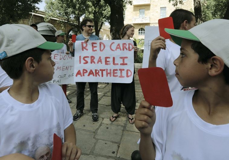 PALESTINIAN KIDS protest in favor of ejecting Israel from FIFA, the soccer federation (credit: REUTERS)