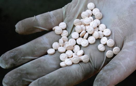 A customs officers displays confiscated Captagon pills (credit: REUTERS)