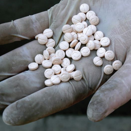 A customs officers displays confiscated Captagon pills (credit: REUTERS)