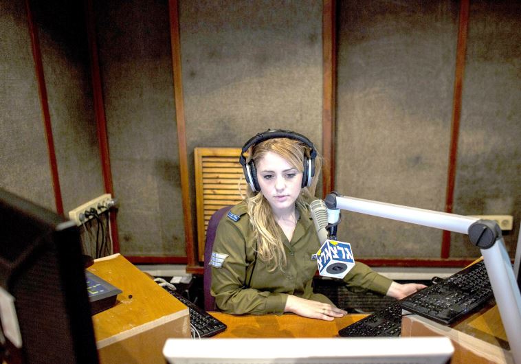 A soldier broadcasts on Galei Tzahal, the IDF radio station