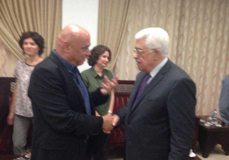 Palestinian Authority President Mahmoud Abbas shakes hands with Meretz MK Esawi Frej as Meretz MKs Tamar Zandberg and Michal Rozin look on‏.