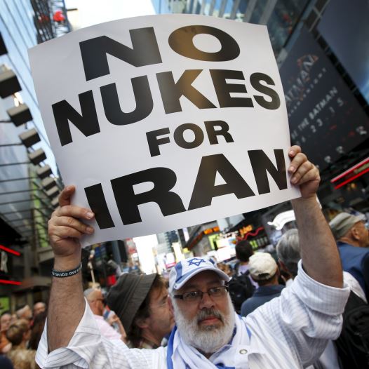 A man holds up a sign as he and several thousand other protestors demonstrate during a rally opposing the nuclear deal with Iran in Times Square (credit: REUTERS)
