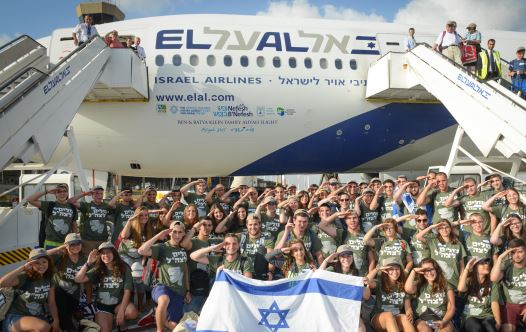 59 lone soldiers make Aliyah on the August 17 Nefesh B'Nefesh Aliyah flight from New York (credit: SHAHAR AZRAN)