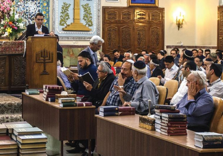 Iranian Jews celebrate Rosh Hashana in 2014 at the Yusef Abad Synagogue in Tehran (credit: OLEKSANDR RUPETA / AFP)
