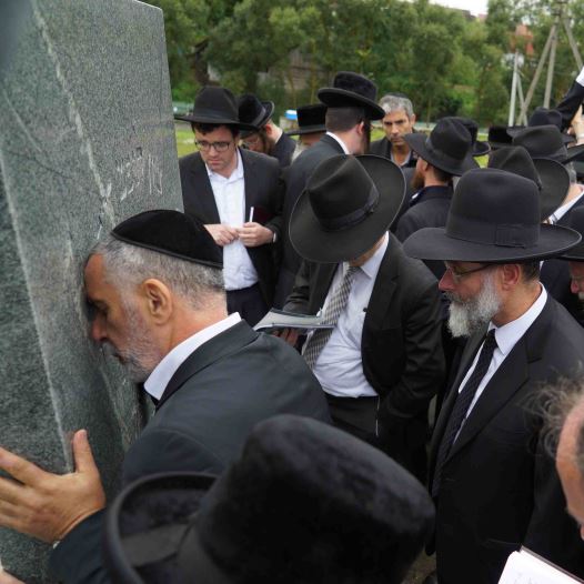 Dozens of rabbis, yeshiva deans, and leaders from the haredi community, including Rabbi Shimon Baadani, a member of the Shas Council of Torah Sages, travelled to Radun and prayed first at the building which formerly housed the yeshiva of the Hafetz Haim, and then by his gravesite itself. (credit: DIRSHU)
